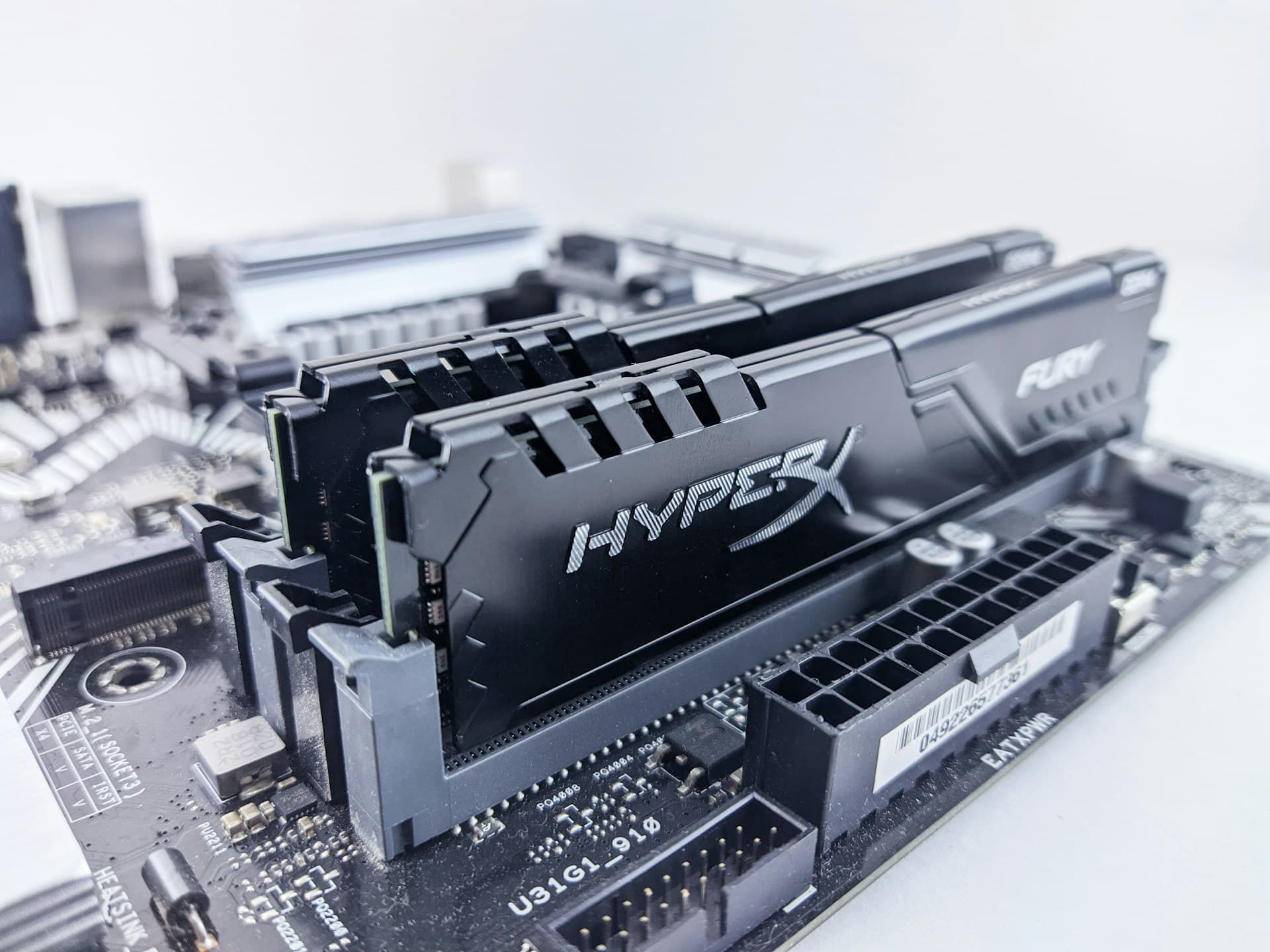 Two HyperX Fury RAM sticks installed in dual channel slots on a motherboard