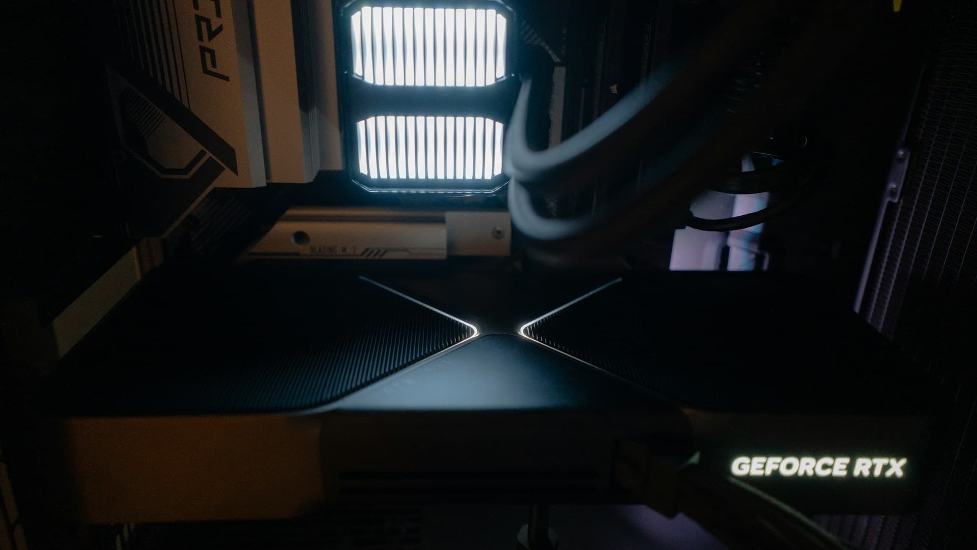 NVIDIA GeForce RTX graphics card installed inside a PC case with RGB lighting